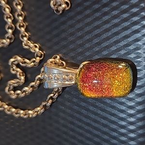 Necklace with iridescent orange pendant
